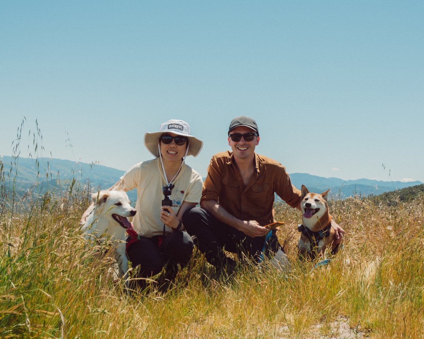 Gianna, Stephen, Kilo and Kujo on a sunny hillside